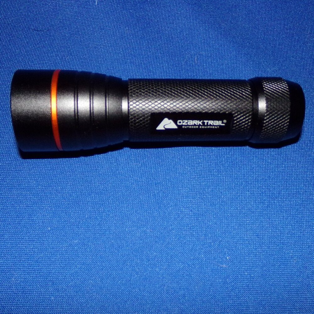 New - Ozark Trail 550 Lumens LED Flashlight, 4 AAA Batteries included